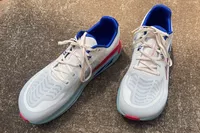 Two Altra Paradigm 7 sneakers posed on concrete