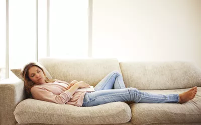 Woman sleeping on sofa