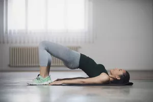 Woman performing a basic bride stretch for tight hips