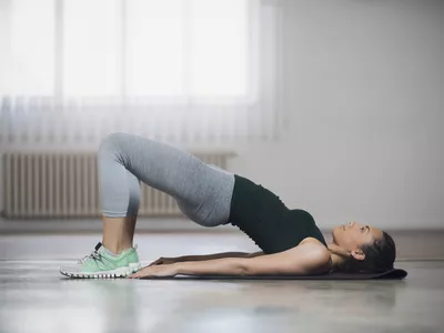 Woman performing a basic bride stretch for tight hips