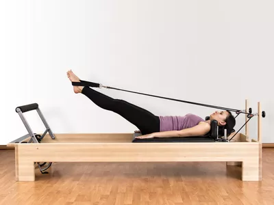 Working Pilates on Reformer Bed