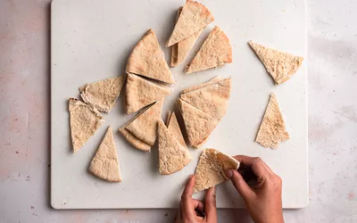 Pita bread cut into pieces and separated in half
