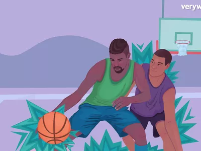 Two men playing basketball